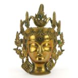 Chinese patinated bronze Buddha head with coloured cabochons, 25.5cm high