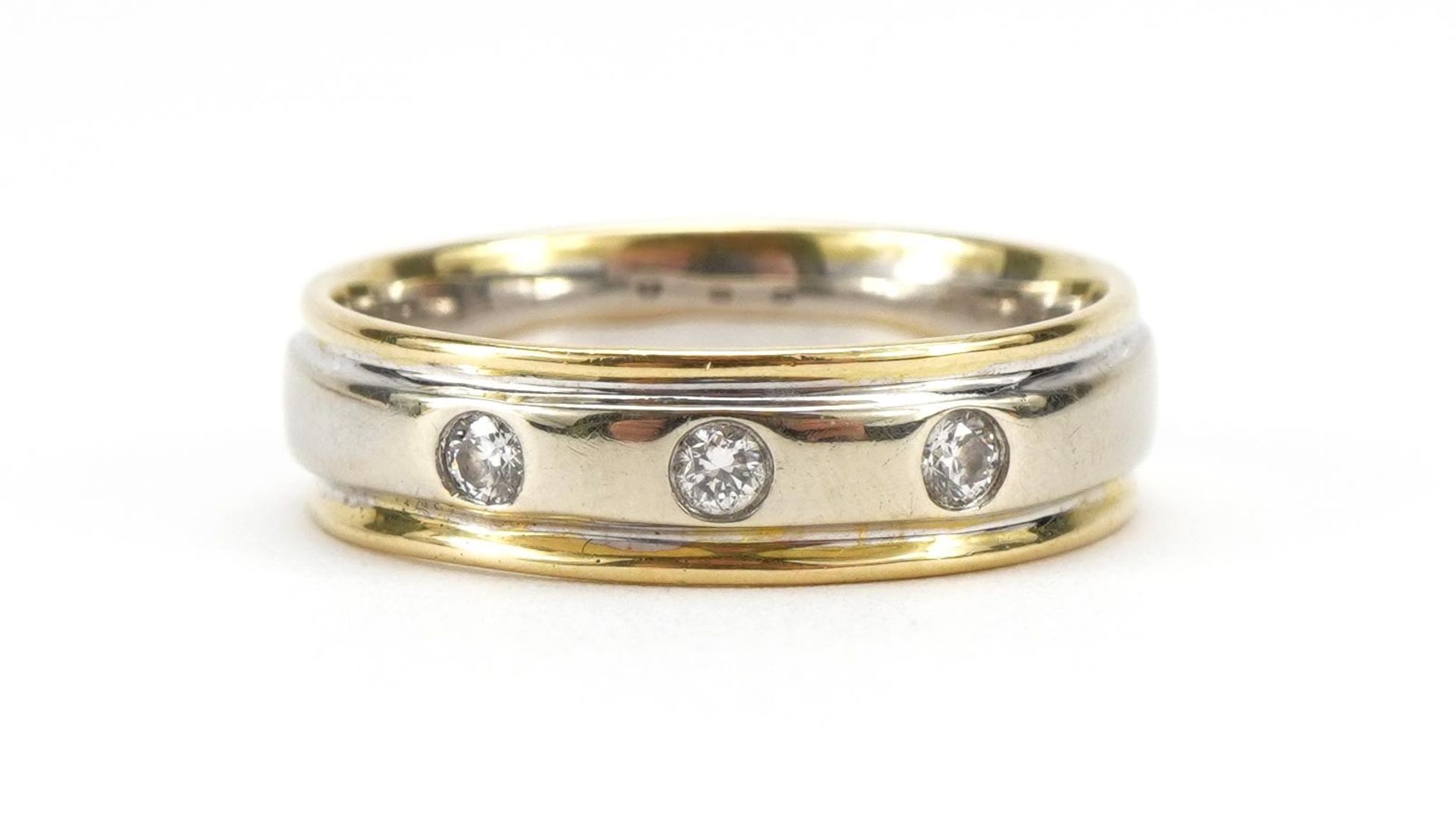 18ct two tone gold ring set with three diamonds, each diamond approximately 2.2mm in diameter,
