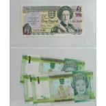 World banknotes arranged in an album including States of Jersey one pounds, Bank of England one