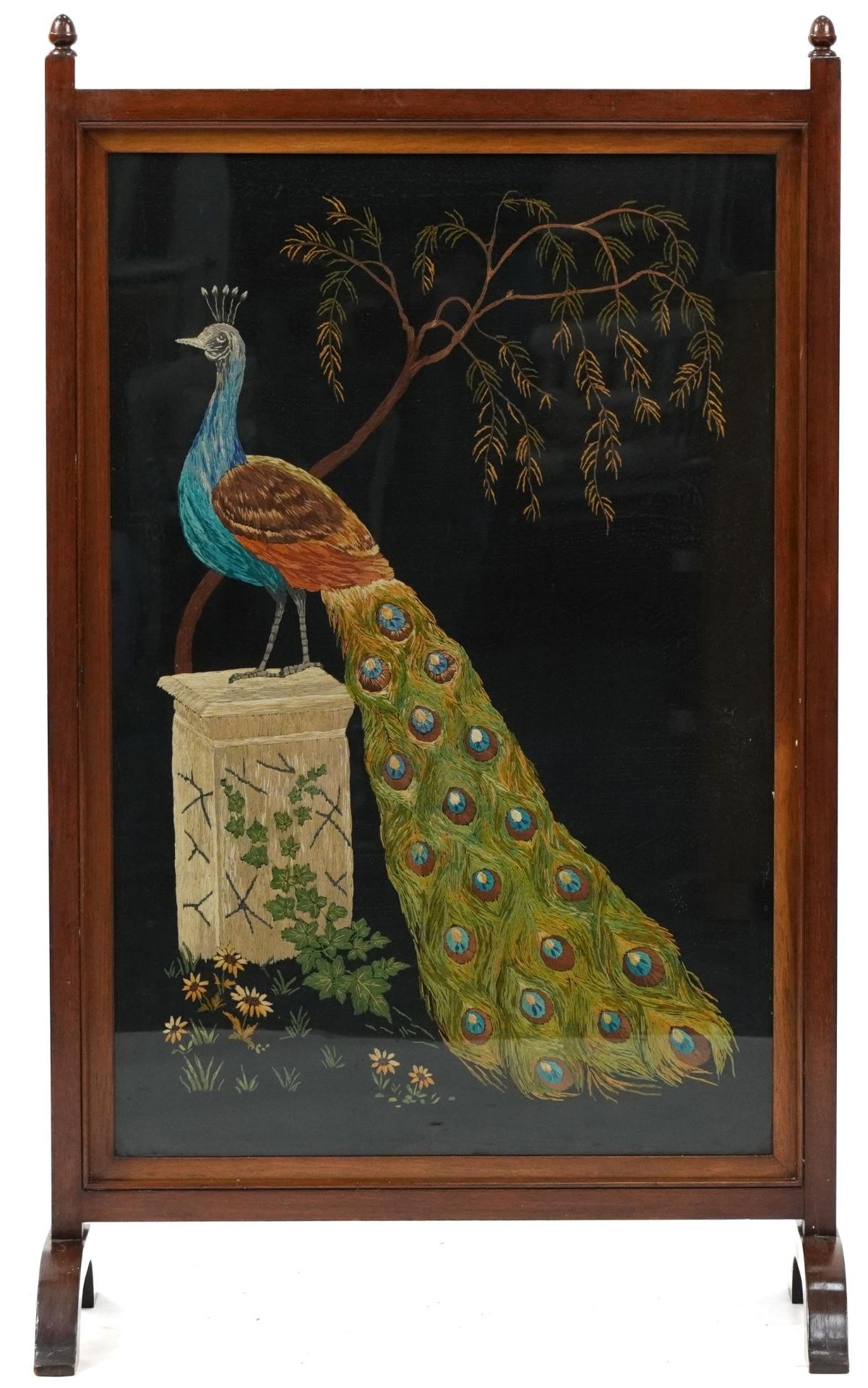 Mahogany and tapestry fire screen depicting a peacock, 100cm high x 59cm wide