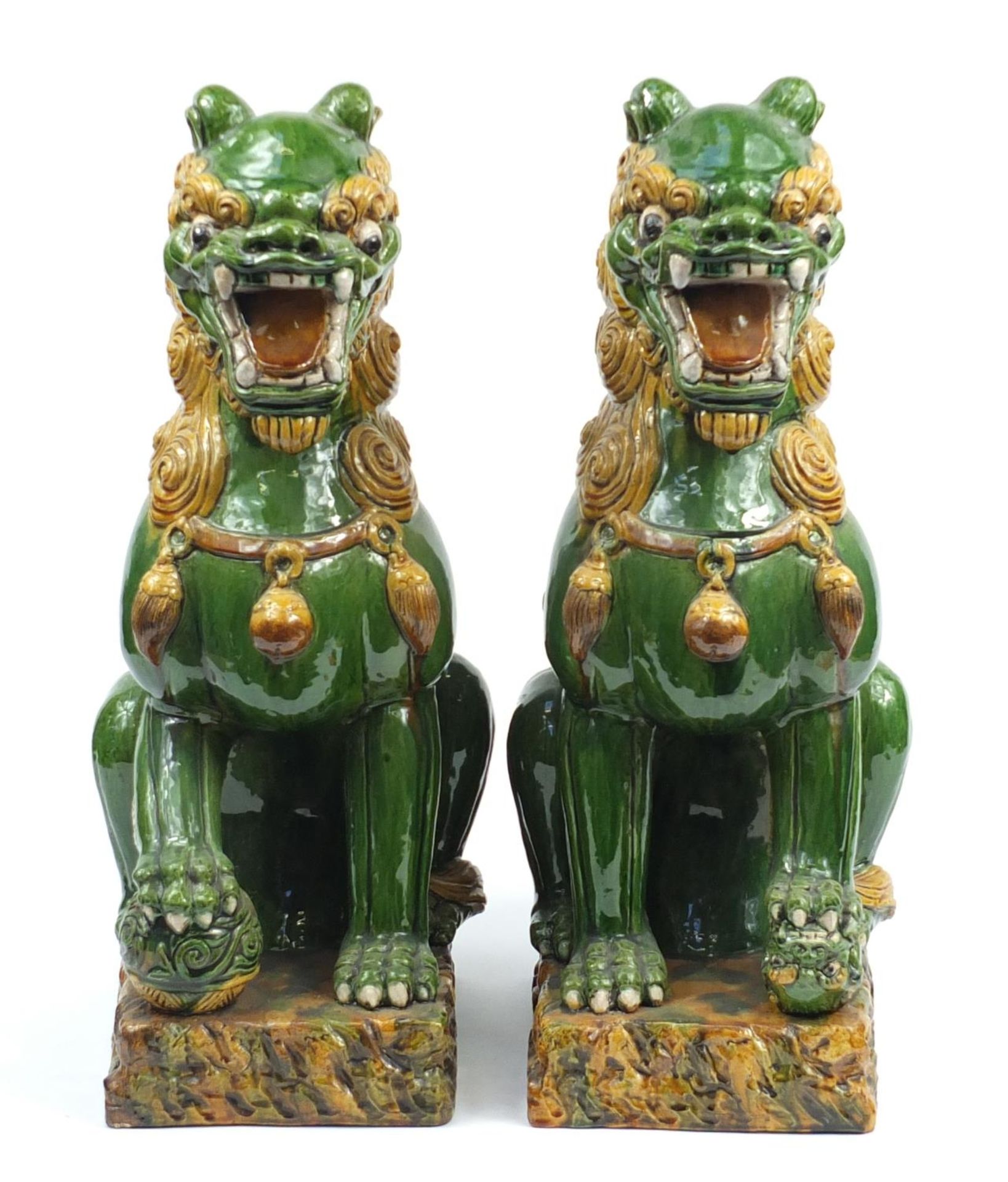 Large pair of Chinese floor standing pottery seated lions having a sancai type glaze, each 59cm high - Image 2 of 7
