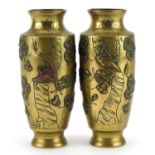 Pair of Japanese bronze vases decorated in relief with birds and flowers, 15cm high