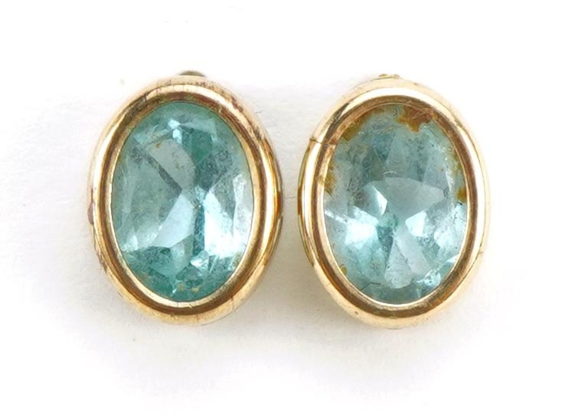 Pair of unmarked gold blue stone stud earrings, possibly aquamarine or blue topaz, 9mm high, 1.2g