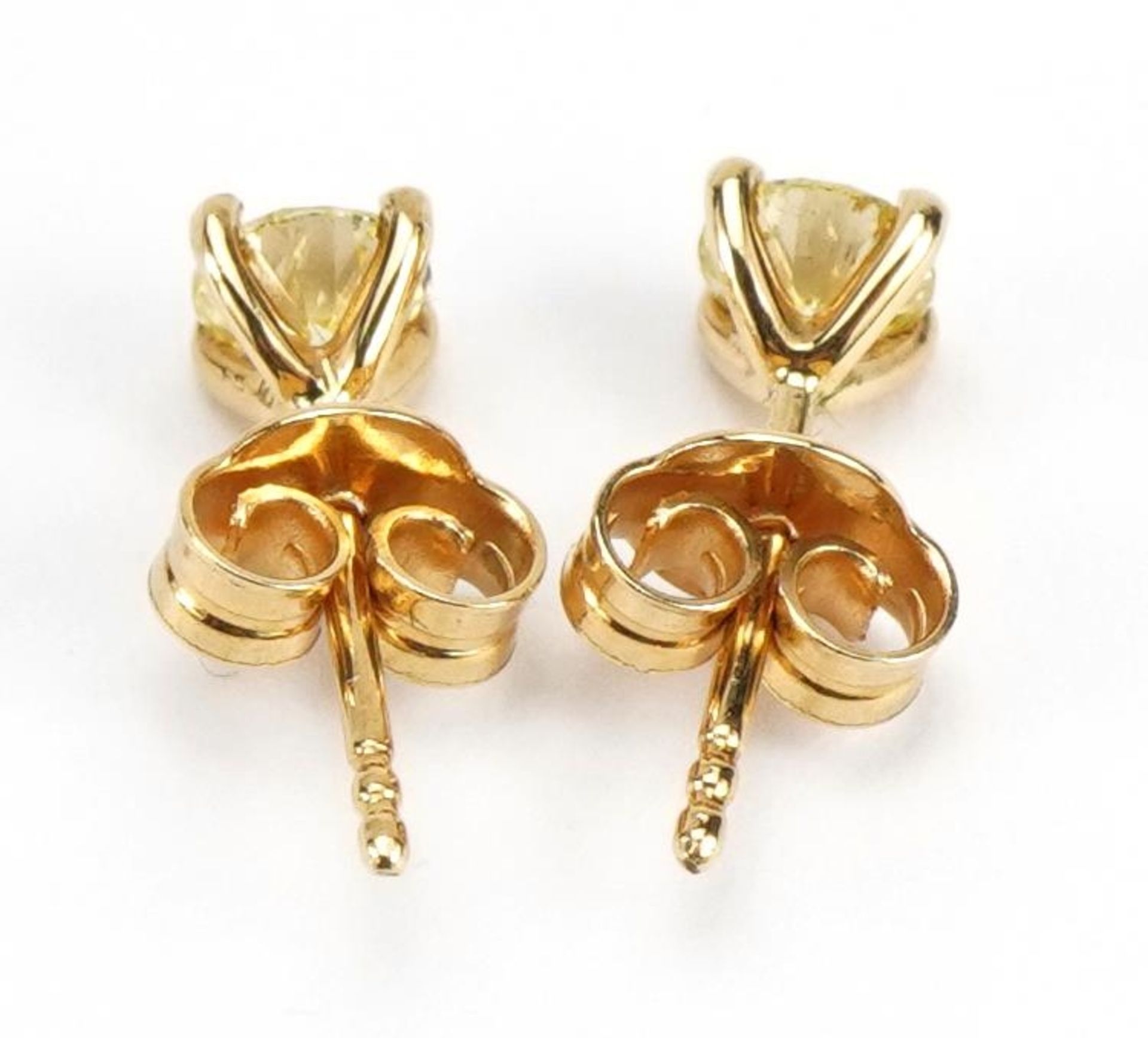 Pair of 18ct gold diamond solitaire stud earrings, total diamond weight approximately 0.61 carat, - Image 2 of 3