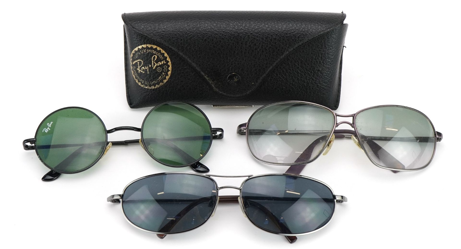 Three pairs of vintage sunglasses including RayBan and Calvin Klein