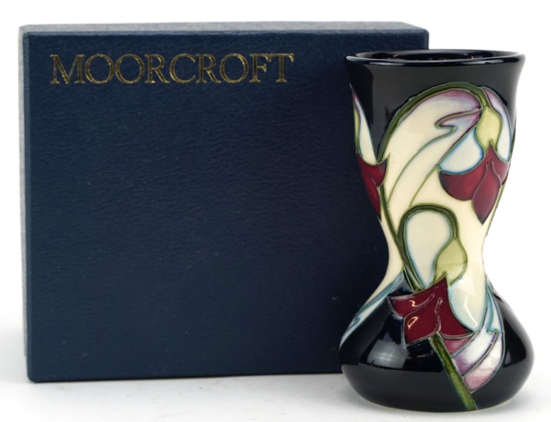 Moorcroft pottery vase hand painted with stylised flowers, dated 2006, with box, 11cm high