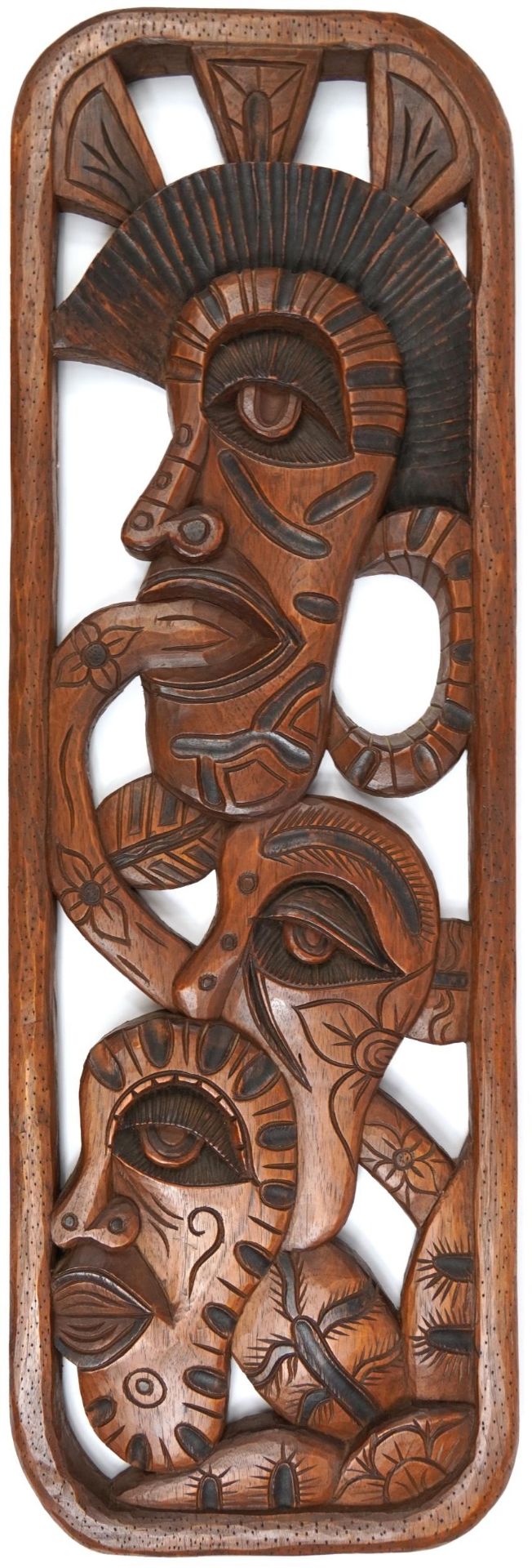 Tribal interest Maori plaque carved with faces, 100cm x 32.5cm