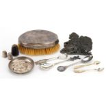 Silver and white metal objects including a silver backed clothes brush, thimbles, teaspoons and a