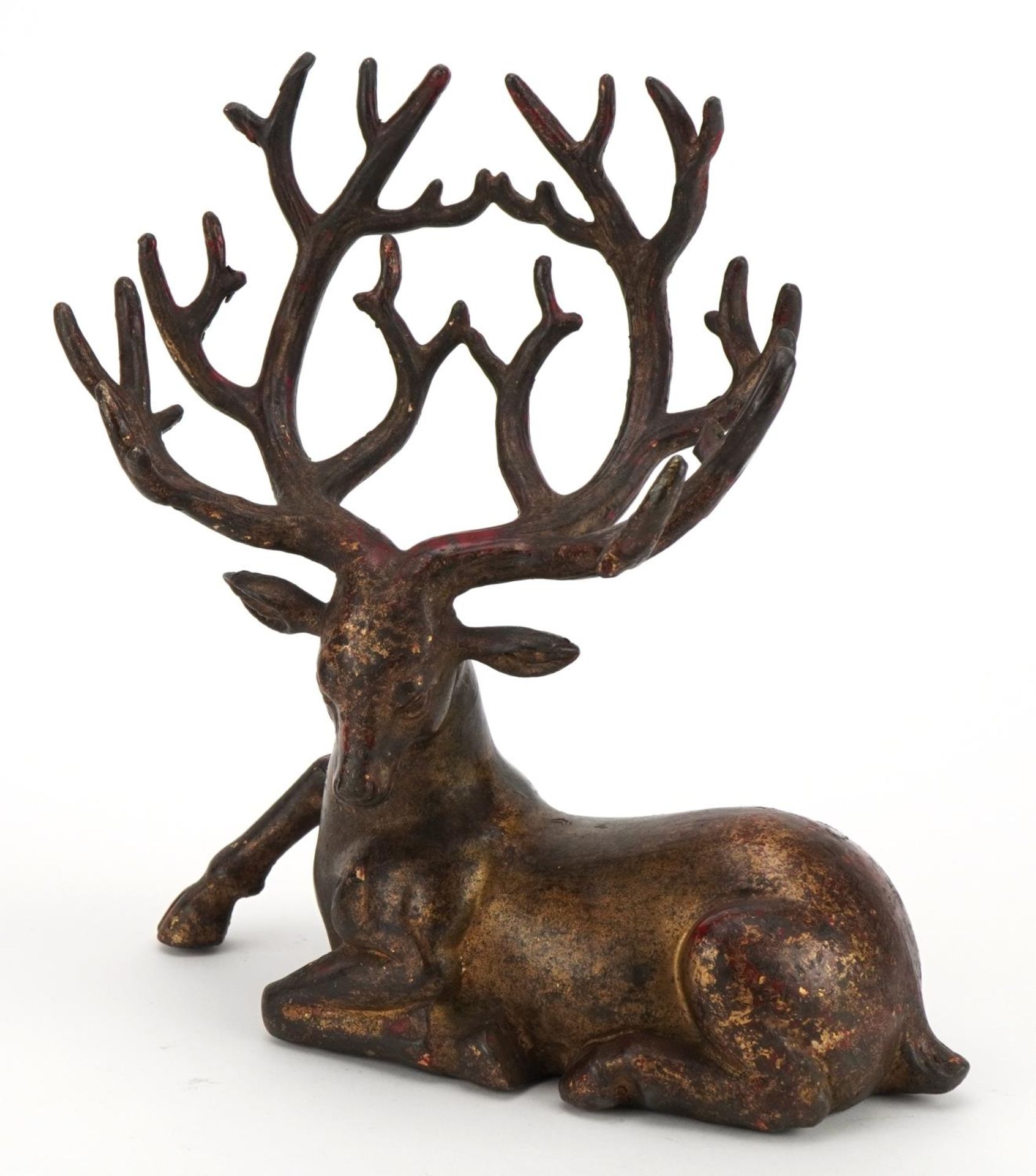 Chinese partially gilt patinated bronze stag, 21cm wide