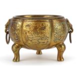 Chinese brass censer with ring turned animalia handles, decorated with figures, 16cm wide