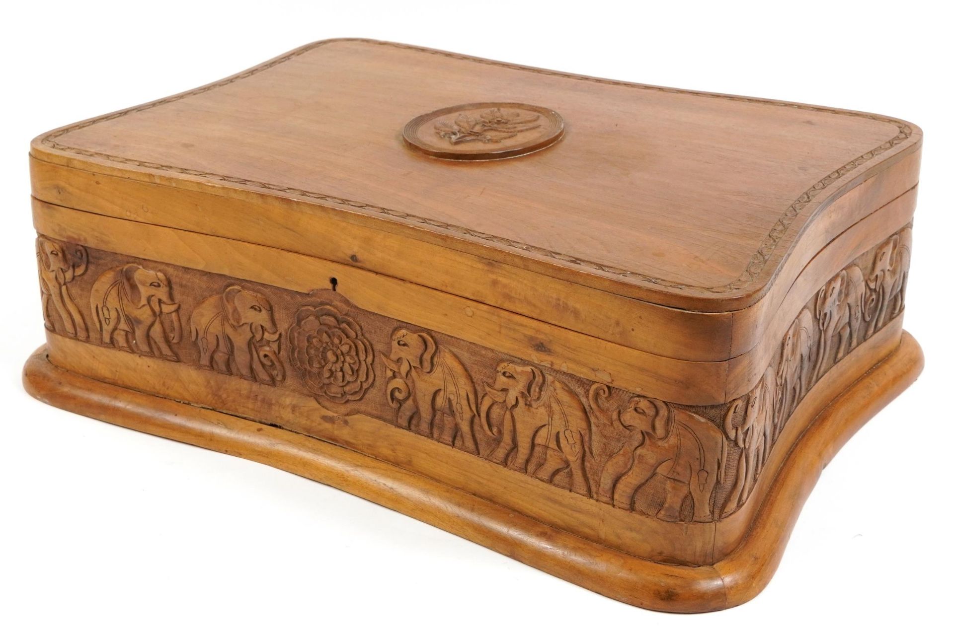 Anglo Indian wooden box with hinged lid carved with elephants, 20cm H x 58.5cm W x 43cm D