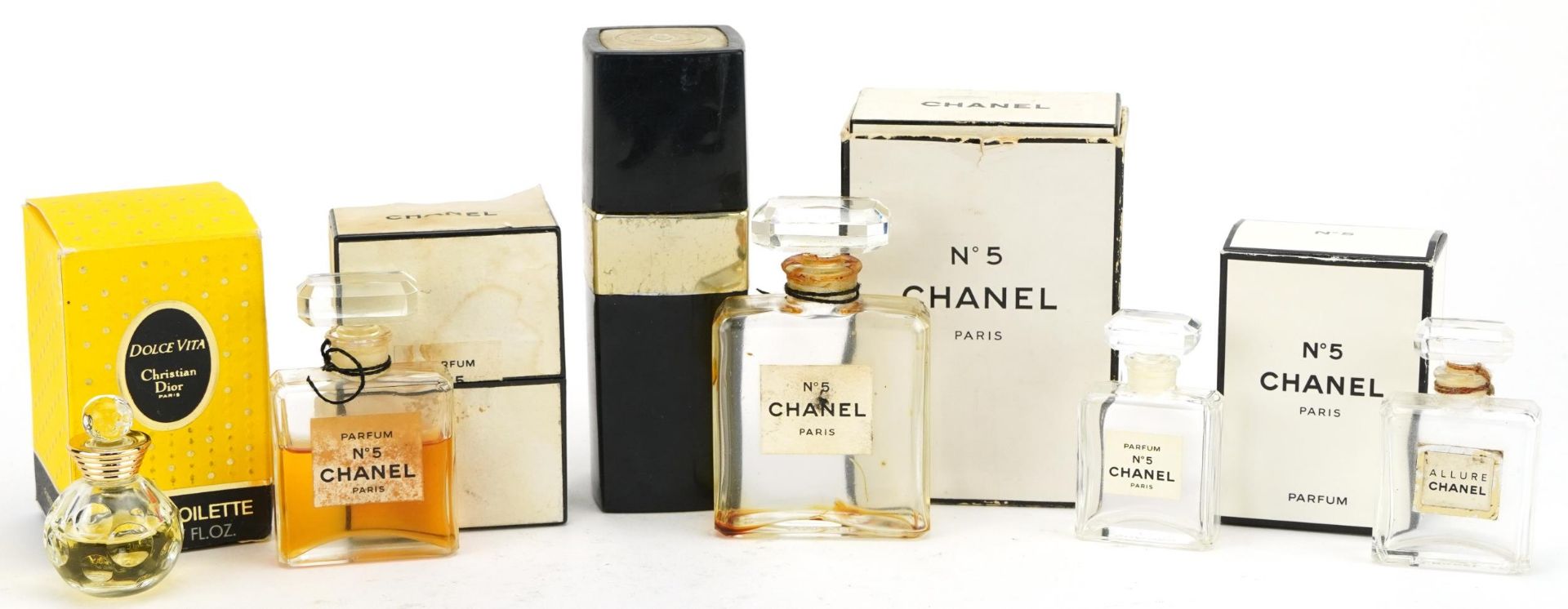 Six vintage perfume bottles comprising Chanel no 5, Coco Chanel and Christian Dior, one with