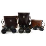 Three pairs of military interest binoculars with cases including Barr & Stroud, Nippon Kogaku and