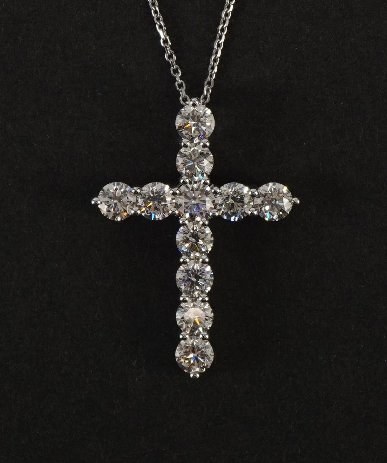 Large 18ct white gold diamond cross pendant on an 18ct white gold necklace, total diamond weight