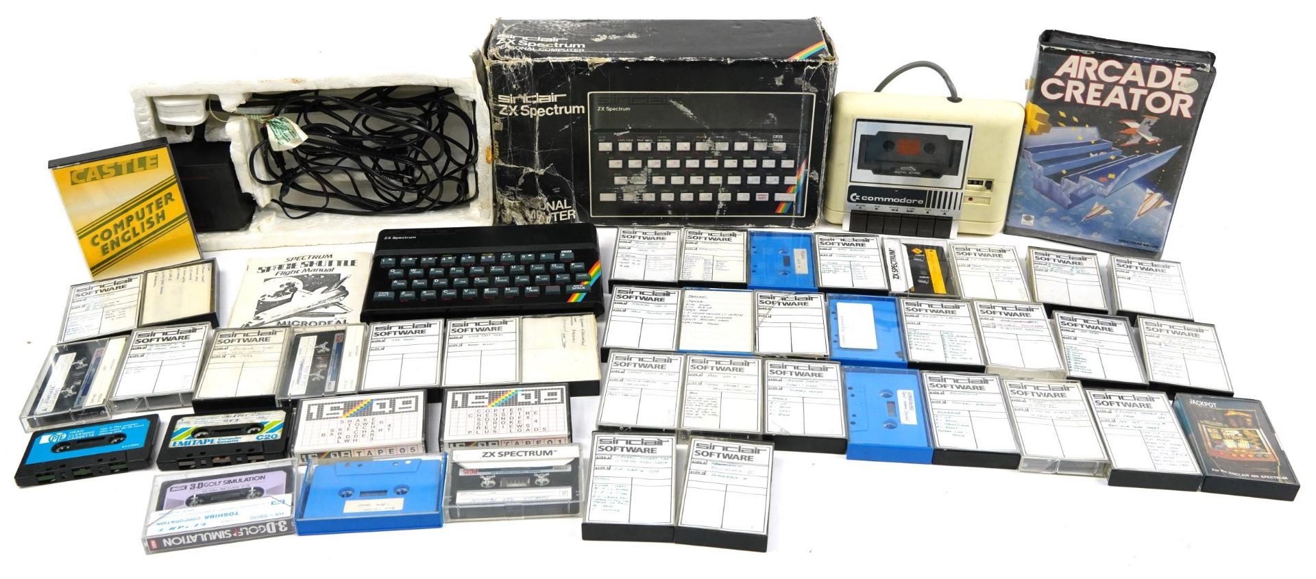 Vintage Sinclair ZX Spectrum with a collection of games and a Commodore Datassette