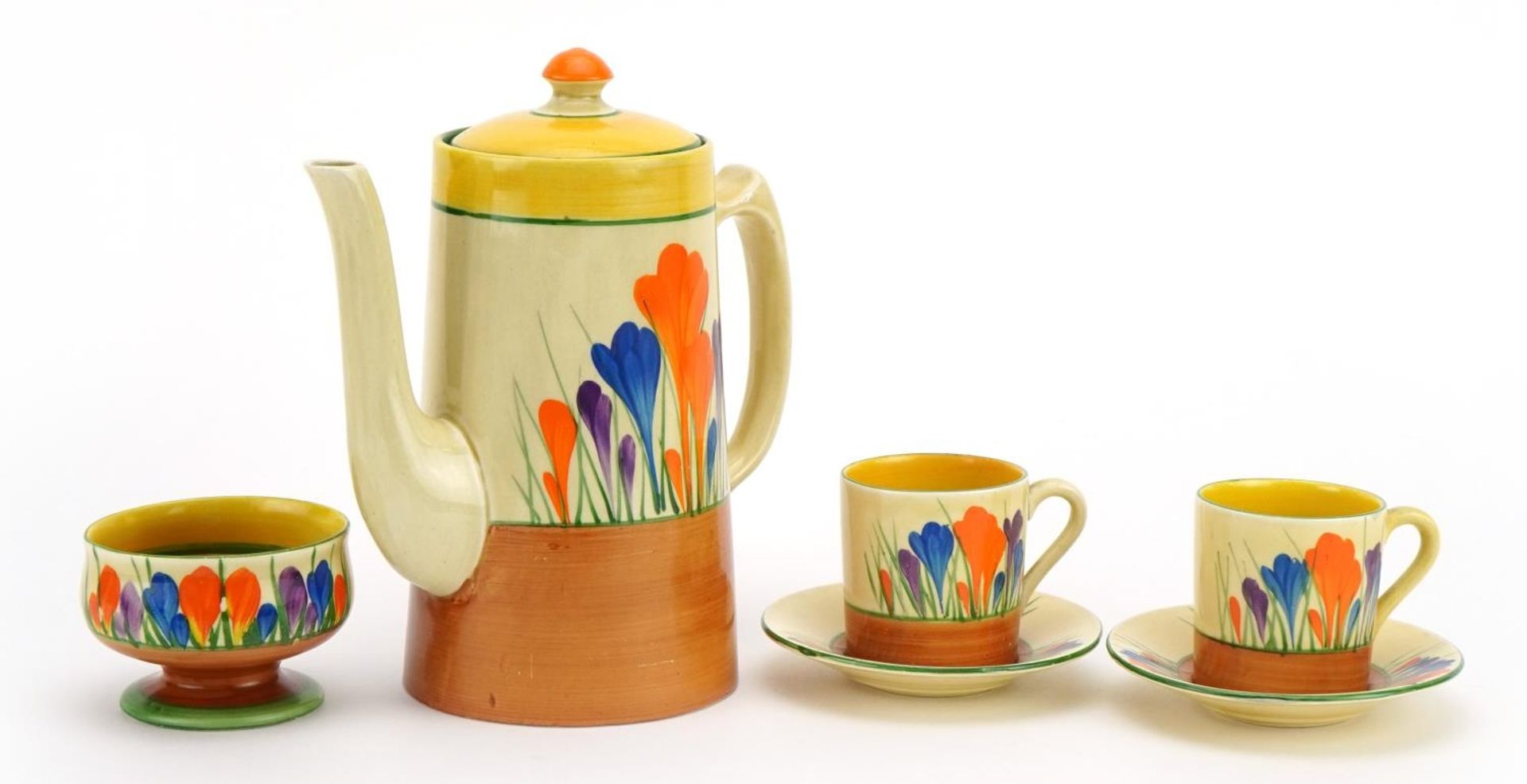 Clarice Cliff, Art Deco Crocus pattern part coffee service comprising coffee pot, two coffee cans