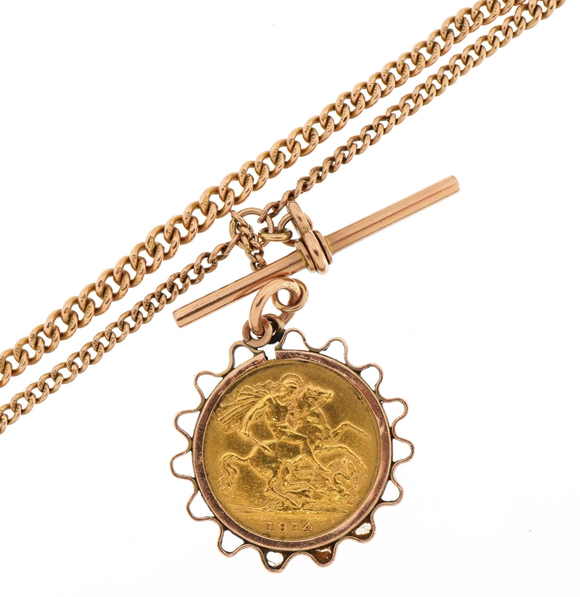 George V 1914 gold half sovereign in pendant mount on 9ct watch chain with T bar and two jewellery