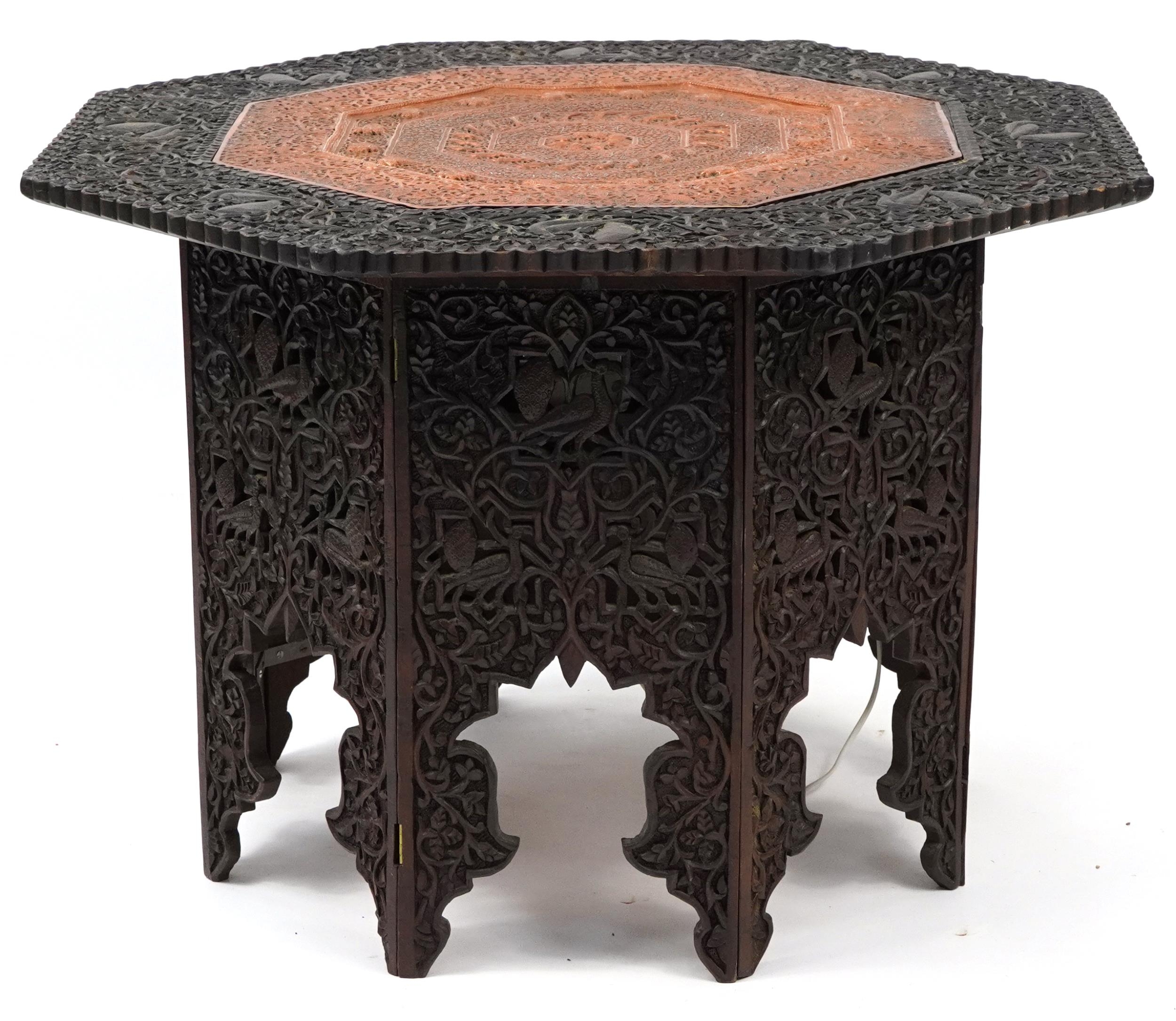 Anglo Indian octagonal oak lamp table profusely carved with birds and fish amongst foliage, 60cm H x - Image 3 of 4