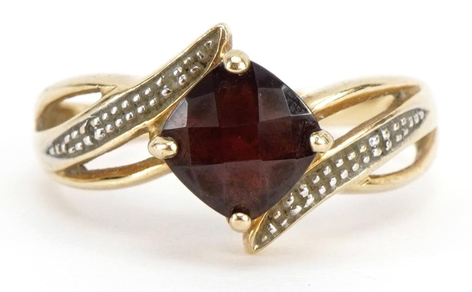 9ct gold garnet and diamond crossover ring, the garnet approximately 7.0mm x 7.0mm, size R, 3.2g