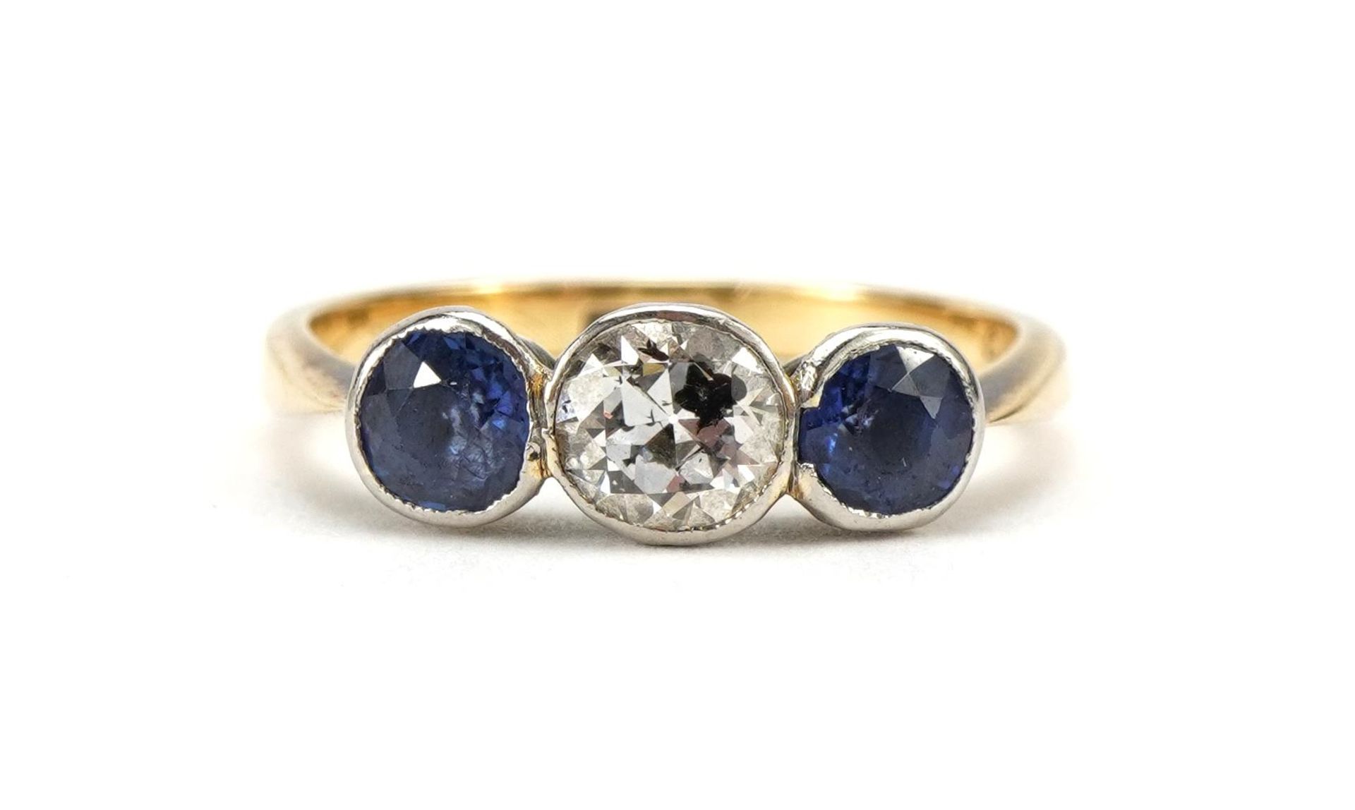 18ct gold diamond and sapphire three stone ring, the diamond approximately 4.3mm x 4.7mm, size M,