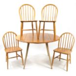 Ercol light elm Windsor drop leaf dining table and four chairs, the table 71cm H x 103cm D x 64cm