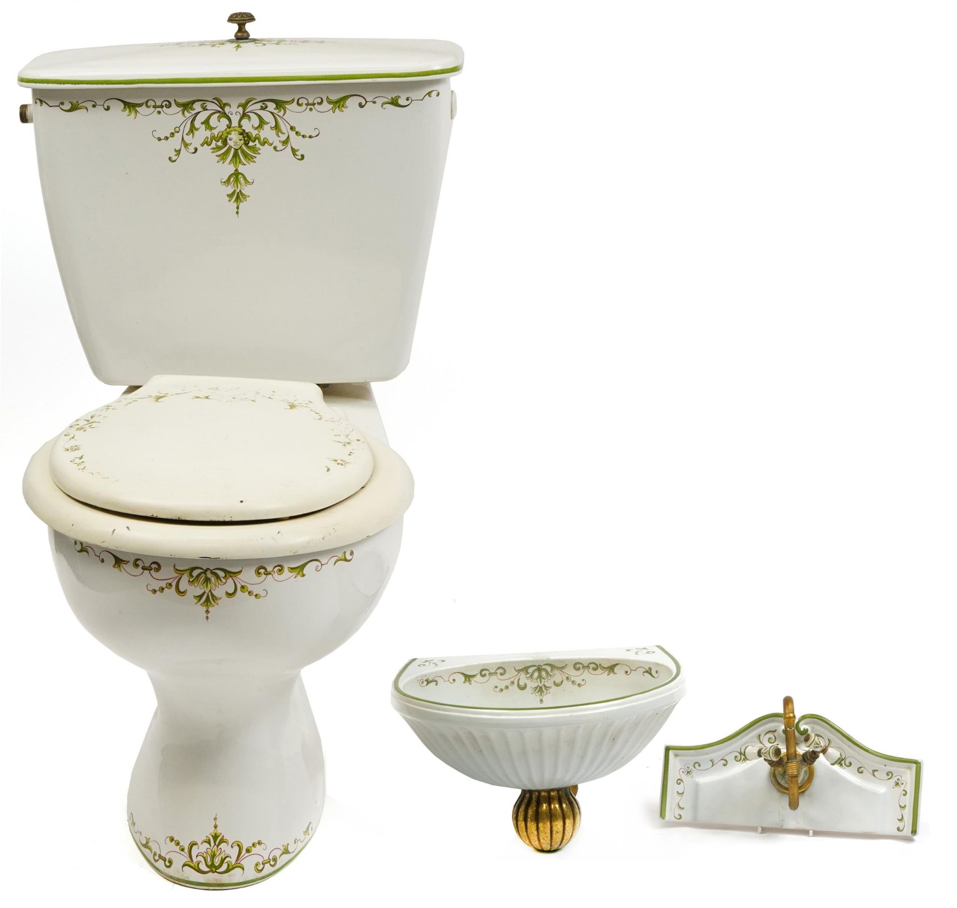 Victorian style bathroom set comprising toilet, cistern and wash basin with tap, the toilet and