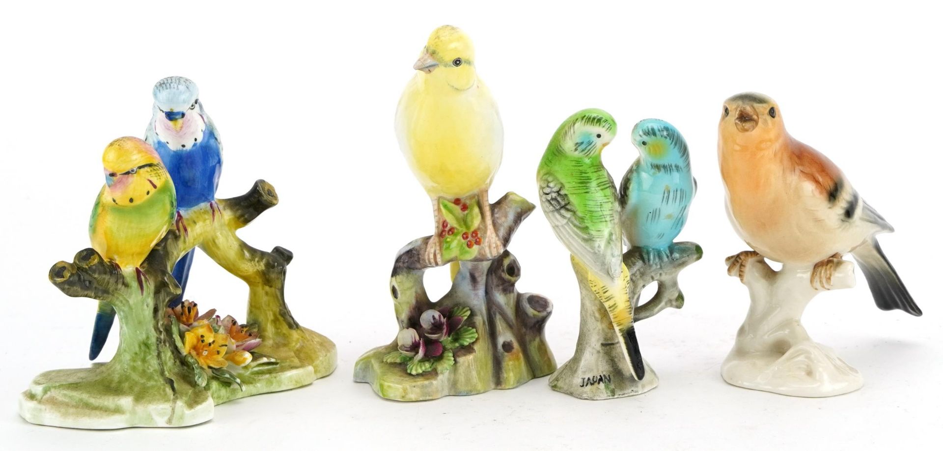 Four porcelain bird groups including Royal Adderley, Staffordshire and Bavaria, the largest 12.5cm