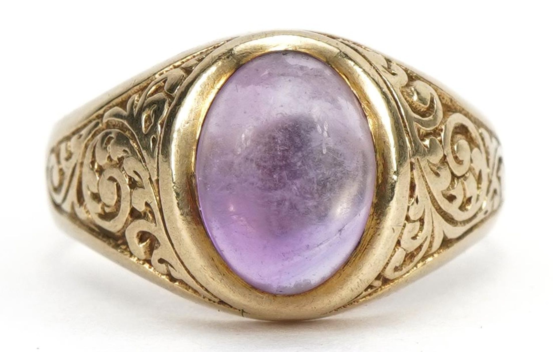 9ct gold cabochon purple stone ring with scrolled shoulders, possibly amethyst, London 1975, the