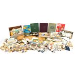 Extensive collection of world stamps arranged in albums, on envelopes and loose