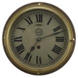 Brass cased ship's design bulkhead clock with Roman numerals, 25cm in diameter,