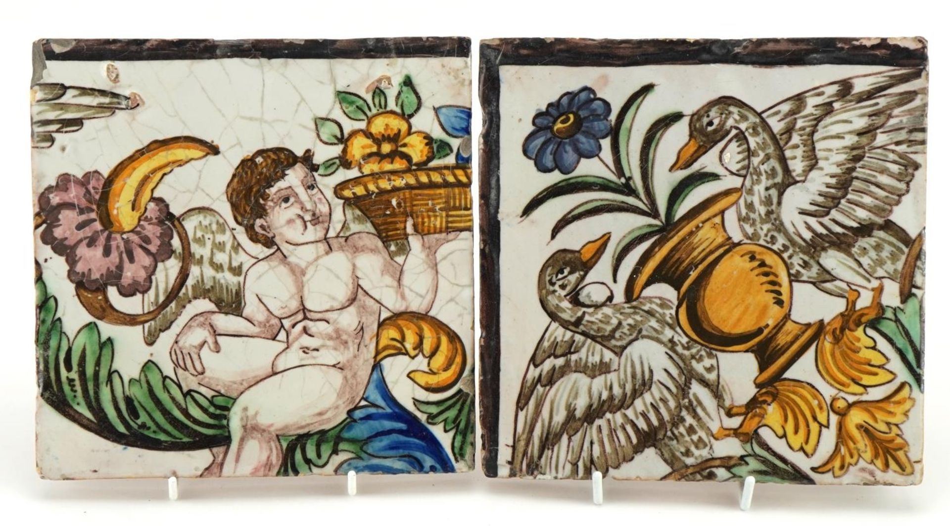 Two large Italian pottery tiles hand painted with a winged figure and geese, each 20cm x 20cm