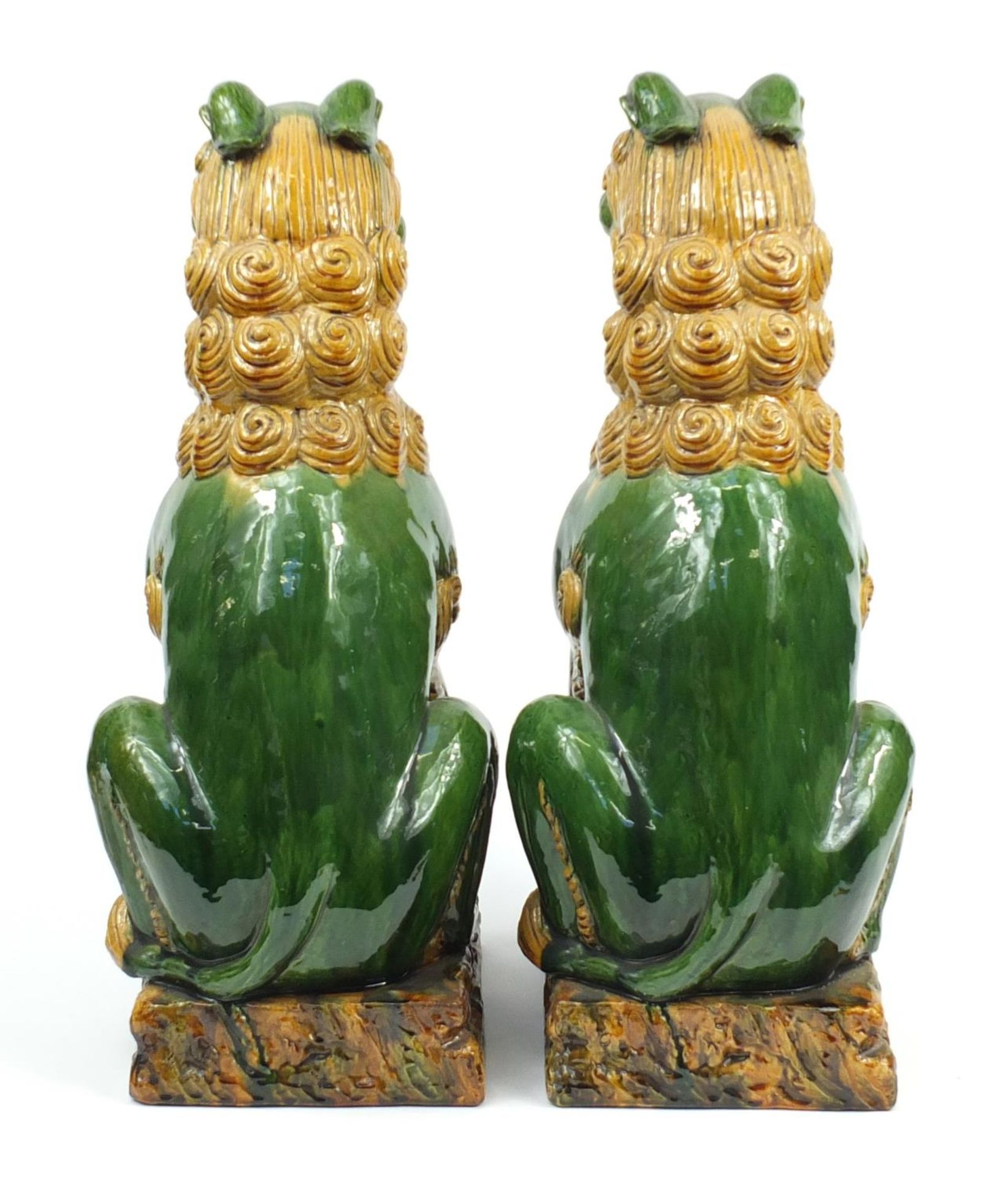 Large pair of Chinese floor standing pottery seated lions having a sancai type glaze, each 59cm high - Image 4 of 7