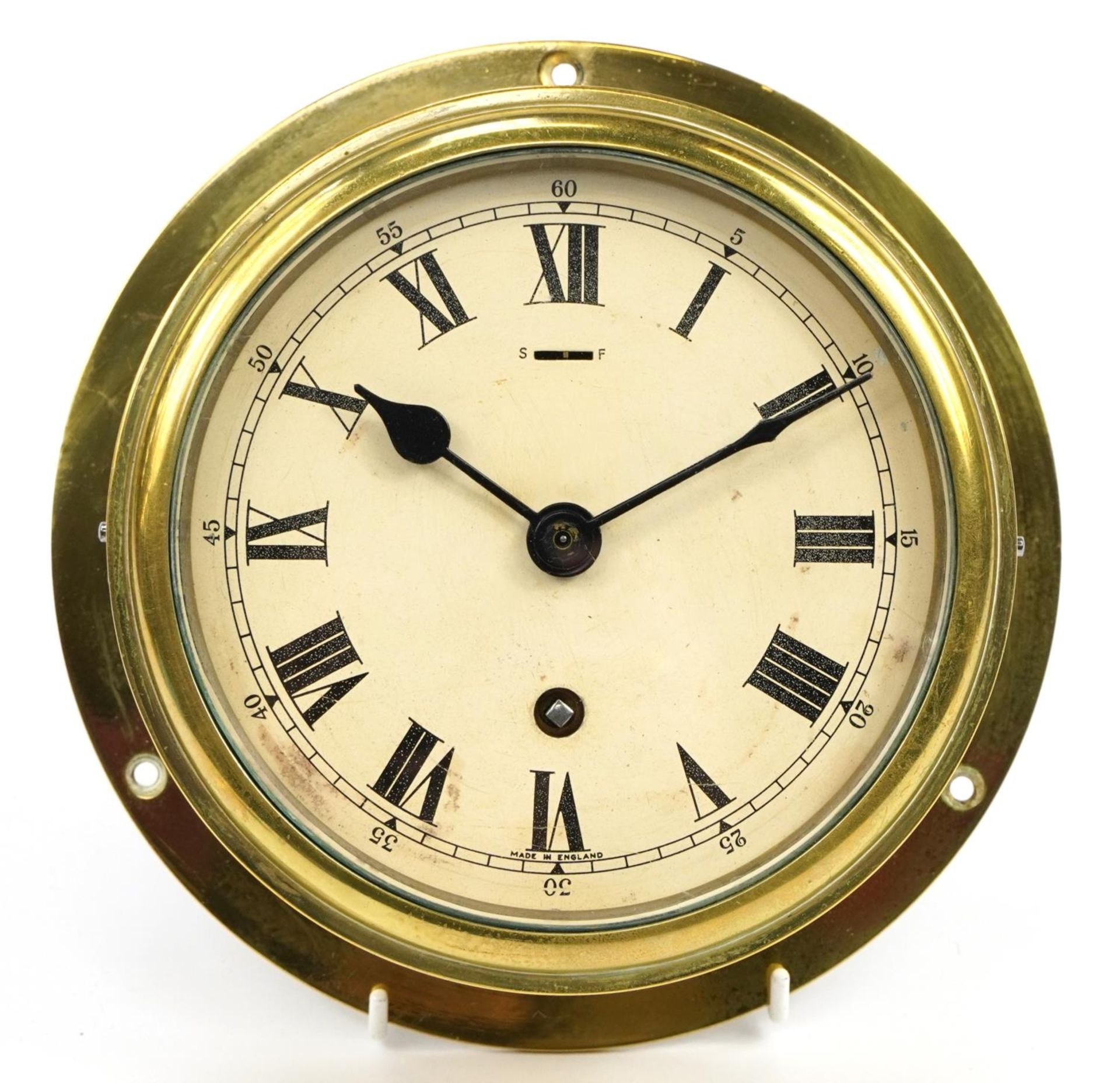 Elliott, brass ship's bulkhead clock, the dial with Arabic numerals, 21cm in diameter