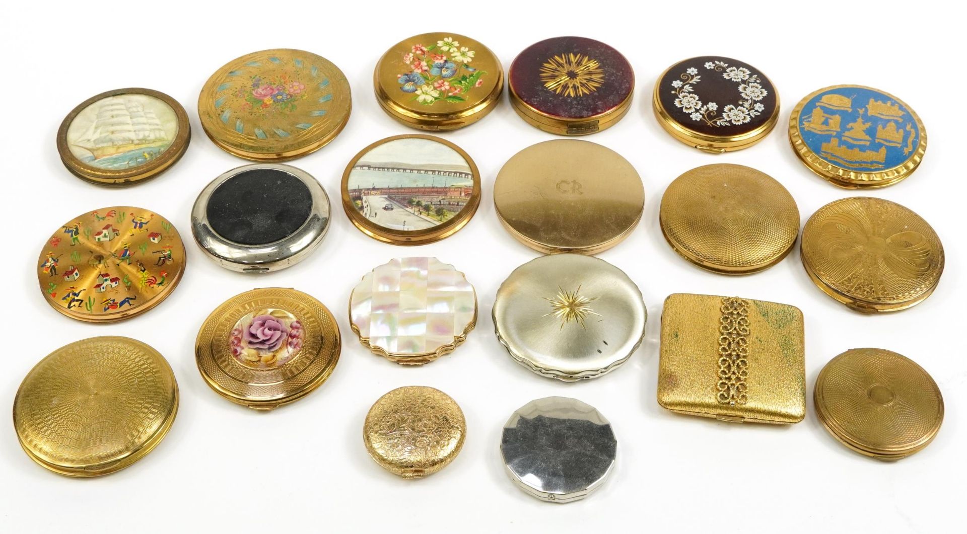 Twenty vintage and later compacts, some with enamel including Stratton, Avon and Yardley