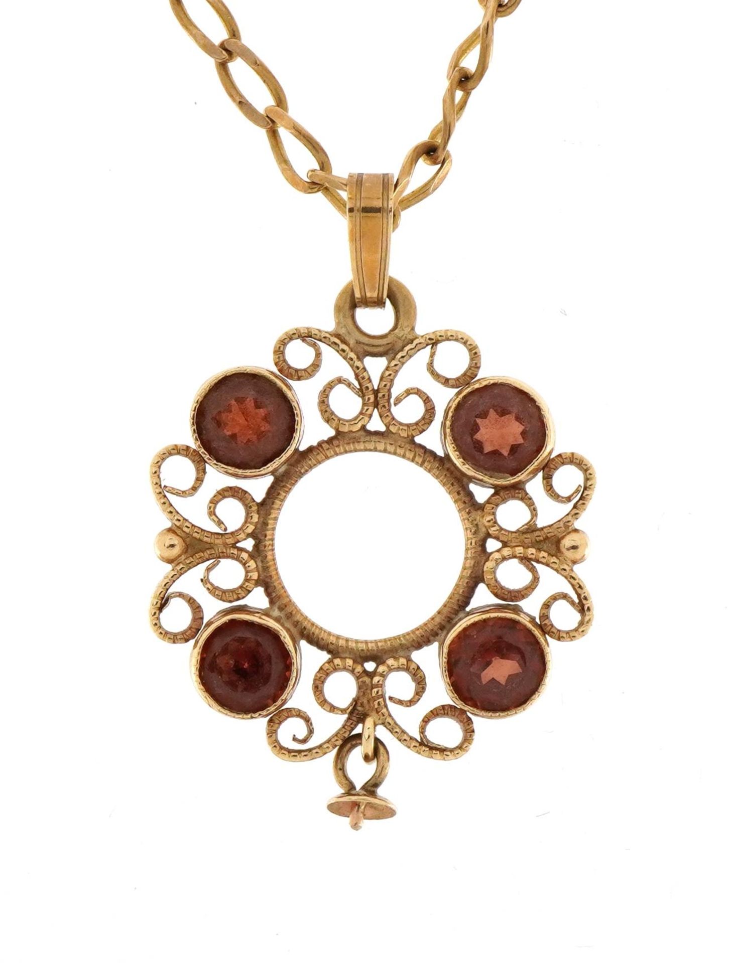 9ct gold filigree pendant set with four garnets on a 9ct gold necklace, 2.9cm high and 50cm in