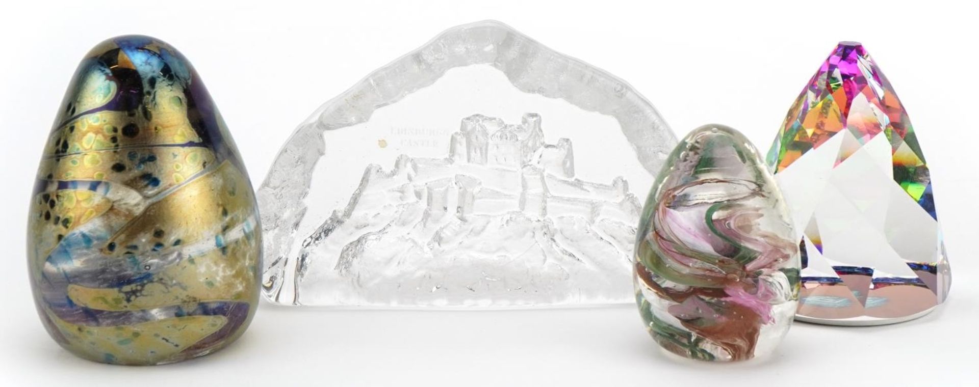 Four glass paperweights including an Alum Bay example, Edinburgh Castle and kaleidoscope, the
