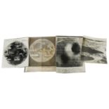 Four mid 20th century black and white press release photographs of the moon, three with paper labels