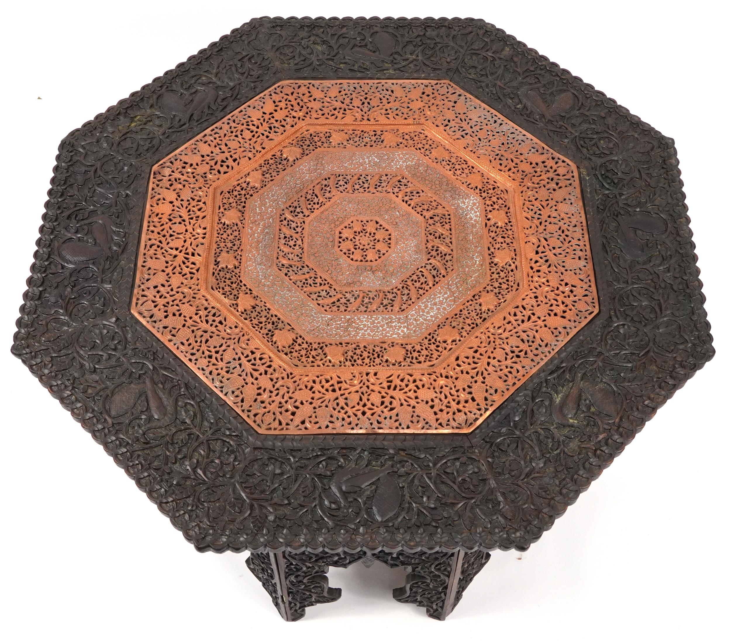 Anglo Indian octagonal oak lamp table profusely carved with birds and fish amongst foliage, 60cm H x - Image 2 of 4
