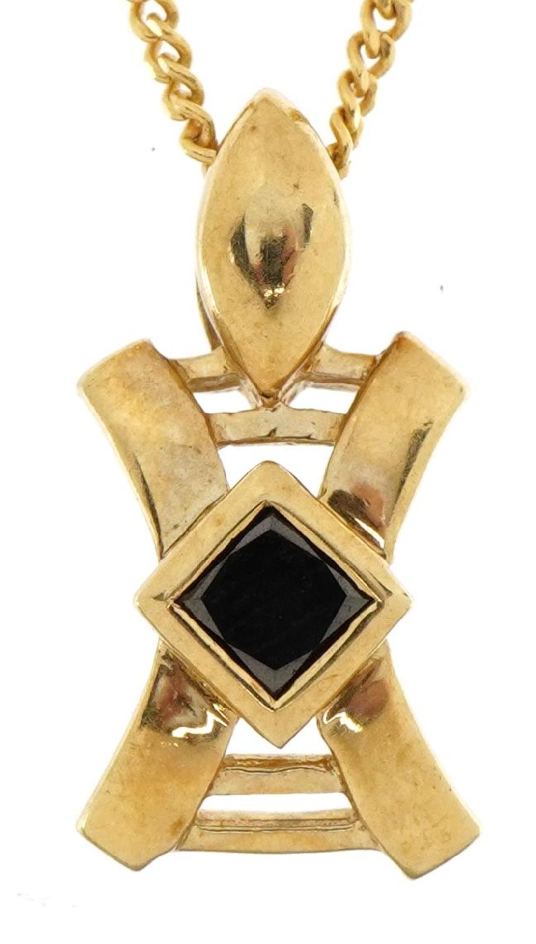 9ct gold pendant set with a black stone, possibly black diamond, on a 9ct gold diamond curb link