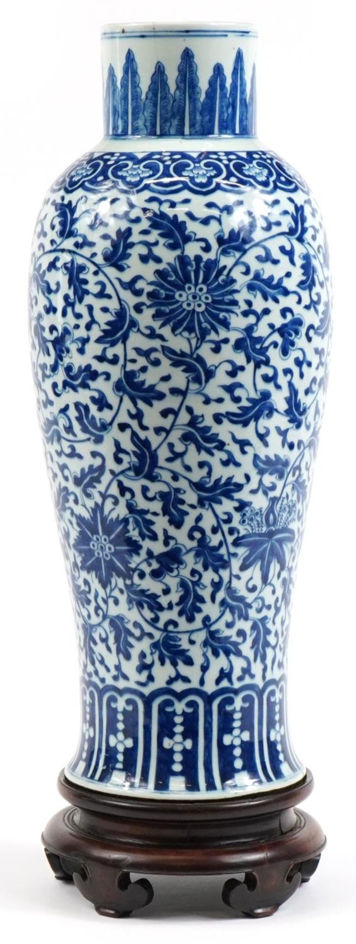 Chinese blue and white porcelain vase hand painted with flowers, raised on carved hardwood stand,