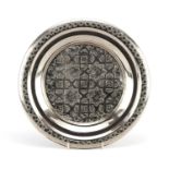 Islamic white metal three footed salver embossed with flowers, 29cm in diameter, 252.0g