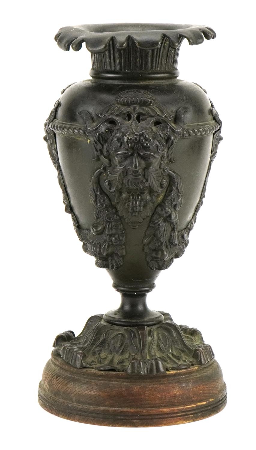 19th century verdigris patinated bronze vase decorated in relief with the Green Man, 29cm high