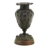 19th century verdigris patinated bronze vase decorated in relief with the Green Man, 29cm high