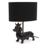 Bronzed Dachshund design table lamp with shade, 34cm high