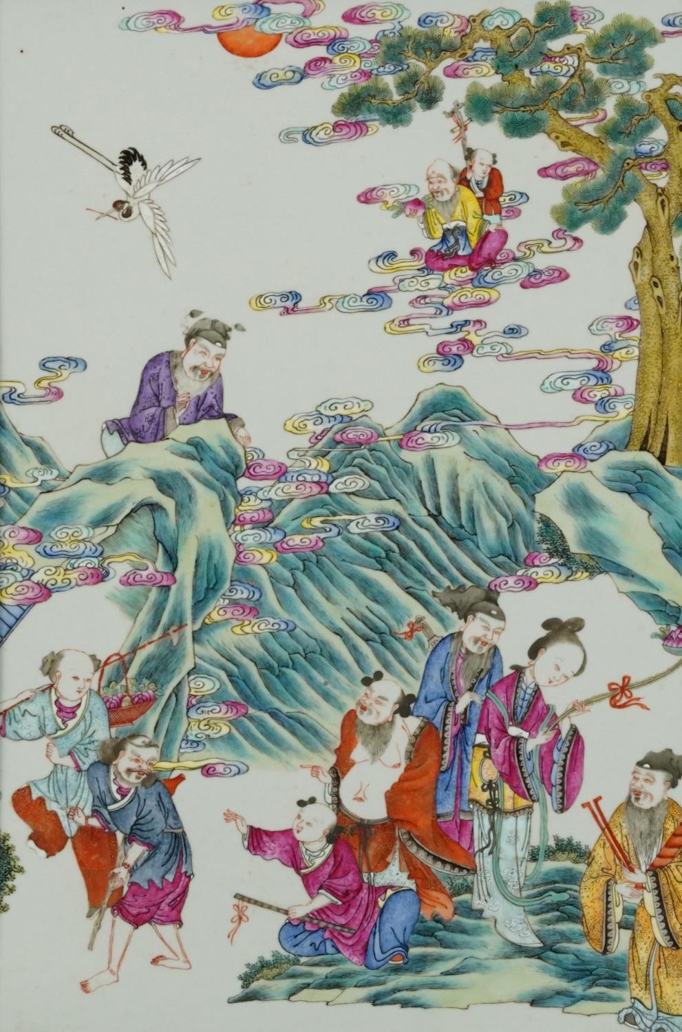 Chinese porcelain panel housed in a hardwood frame, finely hand painted in the famille rose