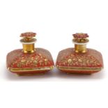 Pair of 19th century French porcelain scent bottles gilded with flowers, each 8.5cm high