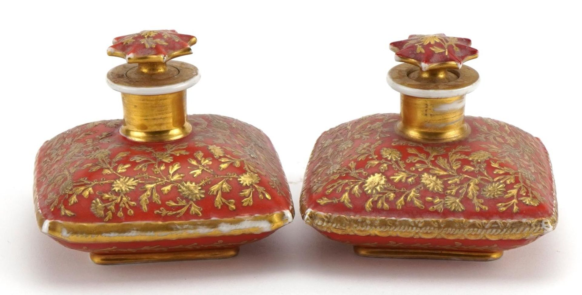 Pair of 19th century French porcelain scent bottles gilded with flowers, each 8.5cm high