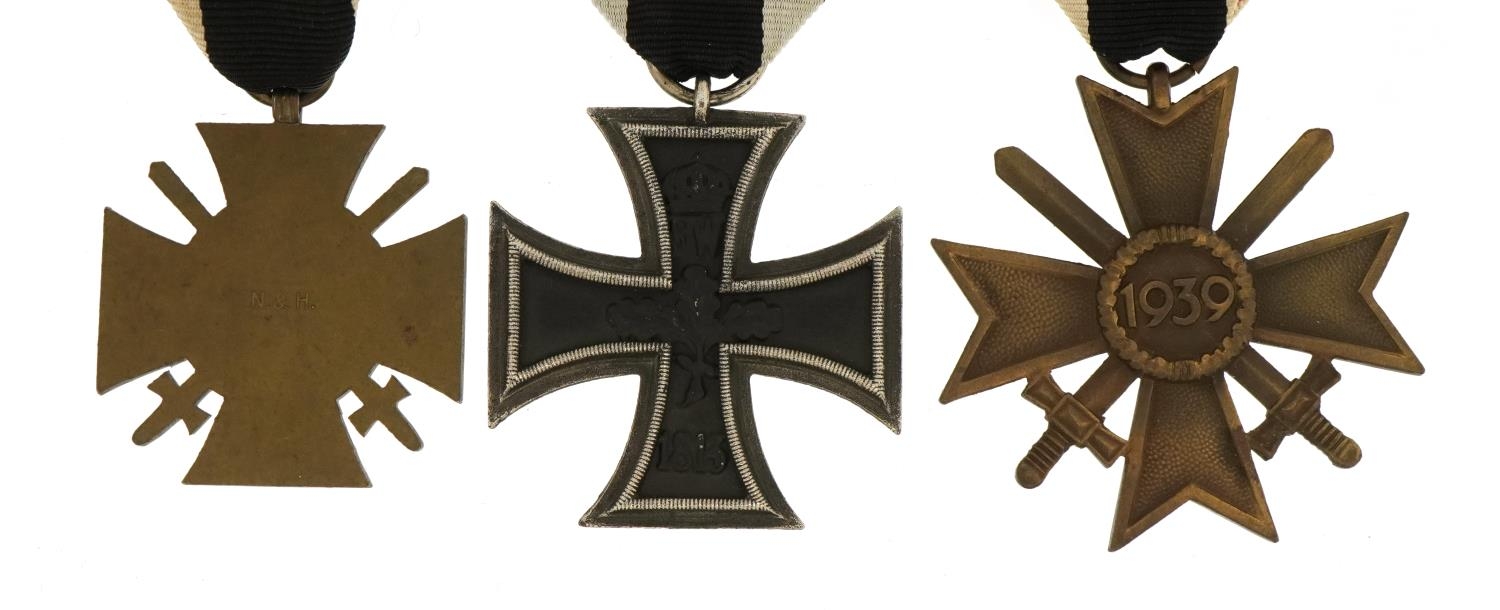 Three German military interest medals comprising Iron Cross, Knights Cross and Honour Cross - Image 3 of 3