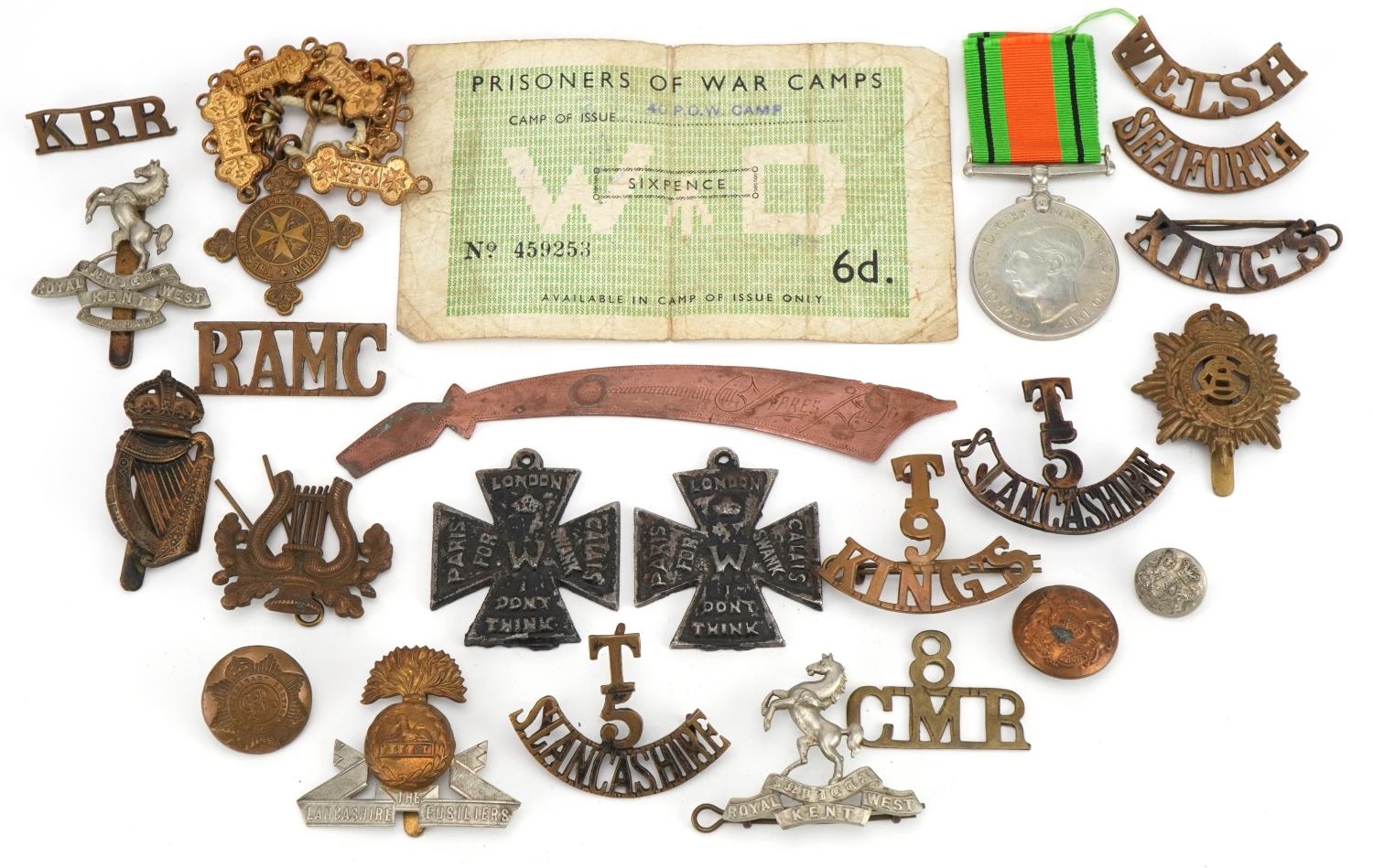 British militaria including shoulder titles, cap badges and World War II Defence medal