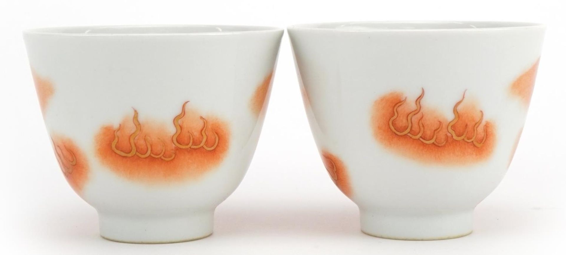 Pair of Chinese porcelain footed tea bowls hand painted in iron red with qilins, four figure - Image 2 of 3